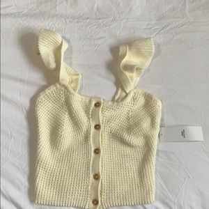 Cute off-white/Cream knitted blouse.